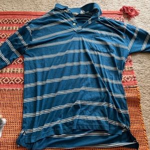 This is a medium sized t-shirt from Studio. Good condition